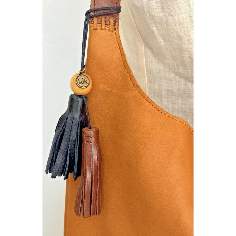 The Sak Women's Huntley‎ Leather Hobo Bag Metro Sling Pebbled Tan with Tassel
